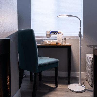 Stella SKY TWO LED Floor Lamp at workspace with sewing machine