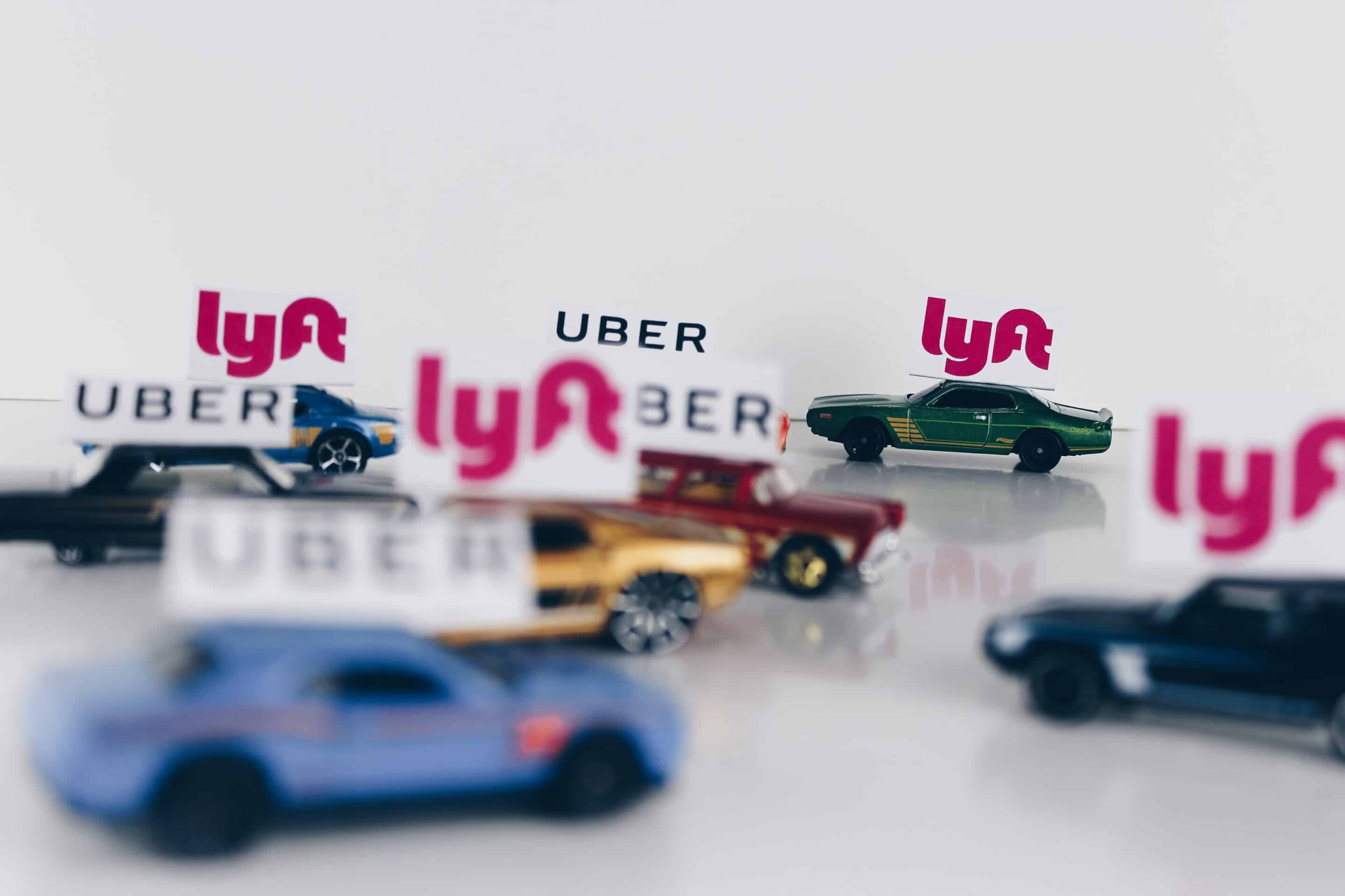 Toy cars with Uber and Lyft logos