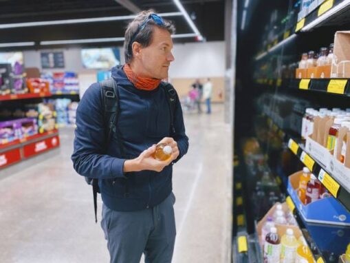 Man in store looking at items on shelf