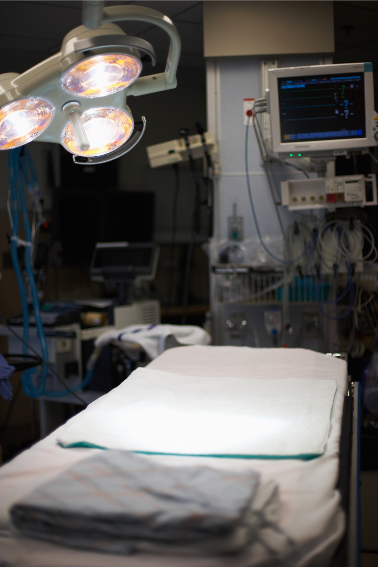 Surgical lamp shining on hospital bed. Proper lighting can improve our cognitive functioning and mental health.