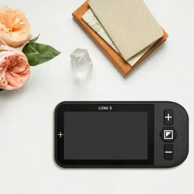 Luna S Portable Video Magnifier with notebooks and flowers