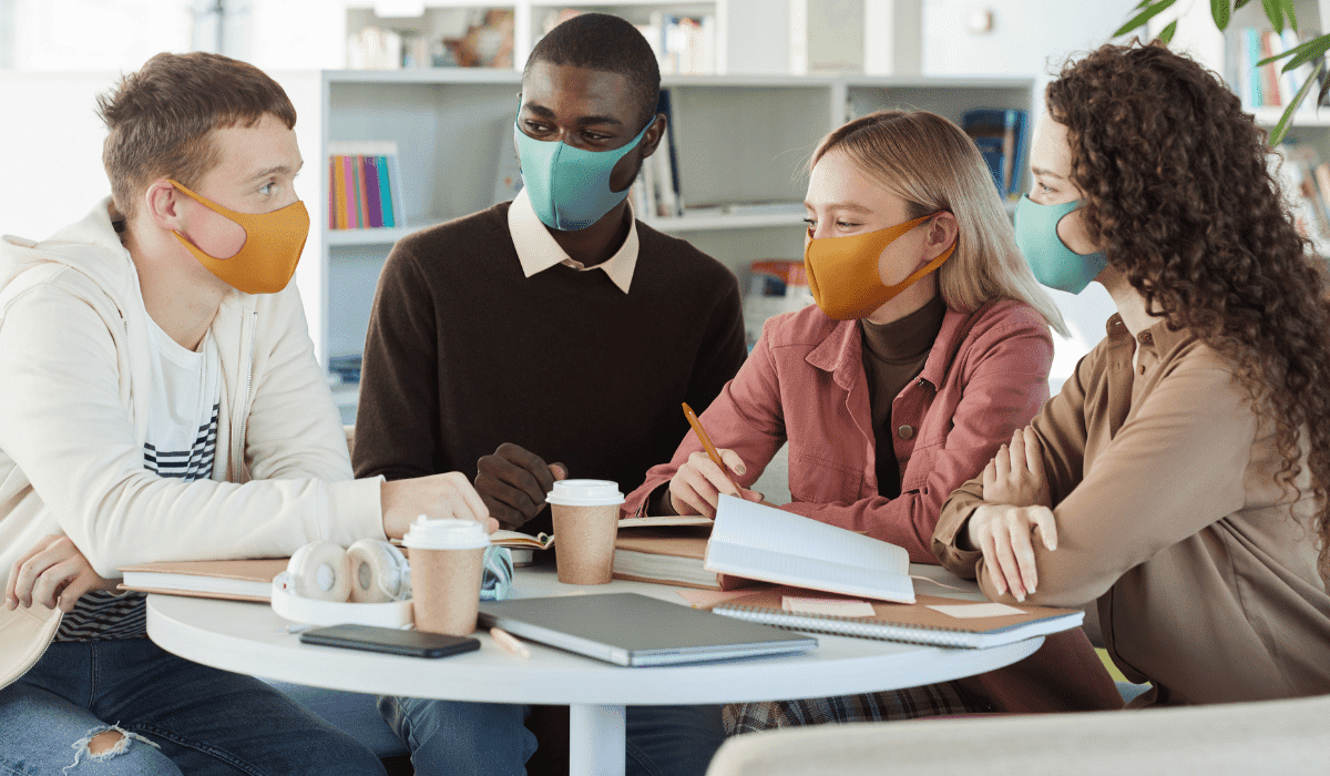 Young people at library wearing masks.