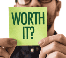 Man holding sticky note with the text "Worth it?"