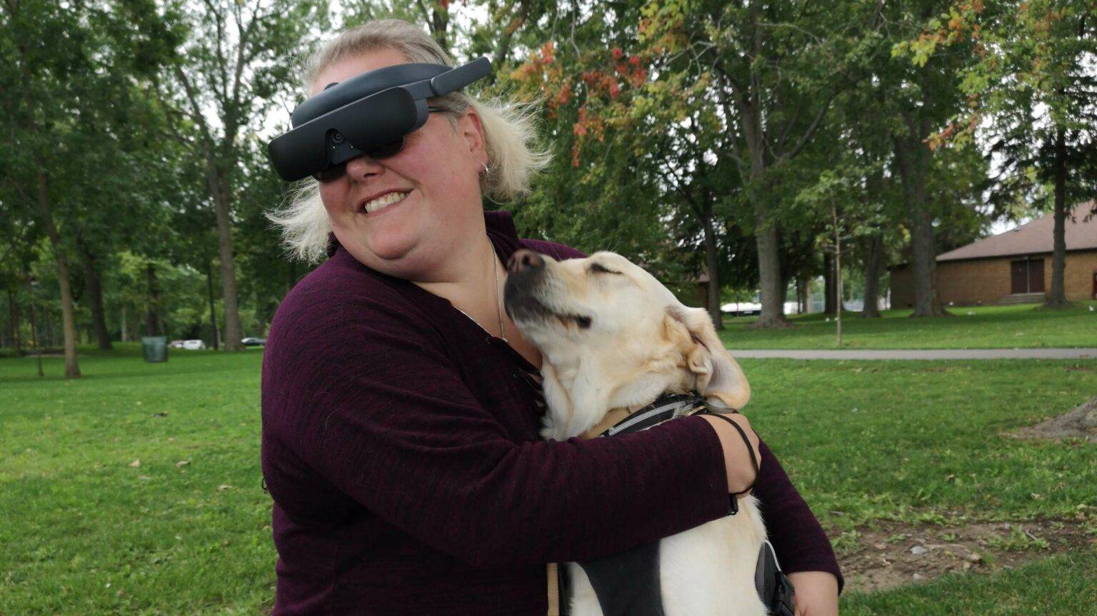 Jaclyn Pope wearing eSight with guide dog, Luna