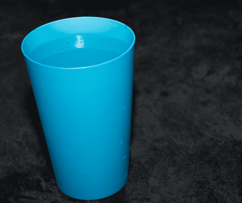 Blue cup with water example of color contrast for low vision