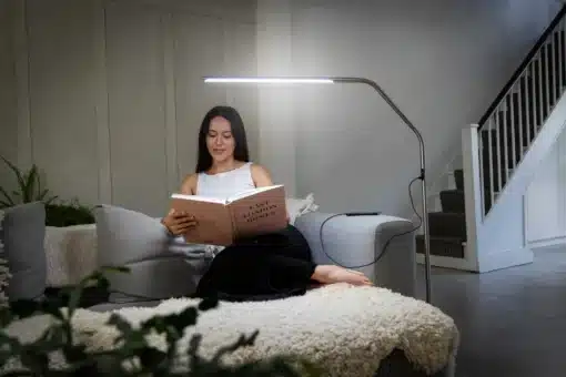 Person reading with Daylight Slimline 4 Floor Lamp