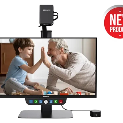 Luna Eye Desktop Magnifier by Zoomax showing a photograph of a young child and an older person giving a high-five with the text "New Product"
