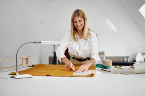 Person using Daylight UnoPro Table Lamp at their workspace