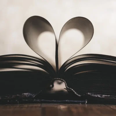 Close-up of open book with pages forming a heart